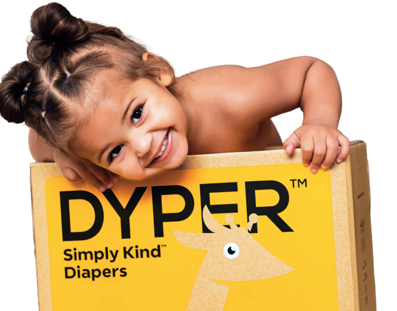 a little girl peeking out of a box of dyper diapers